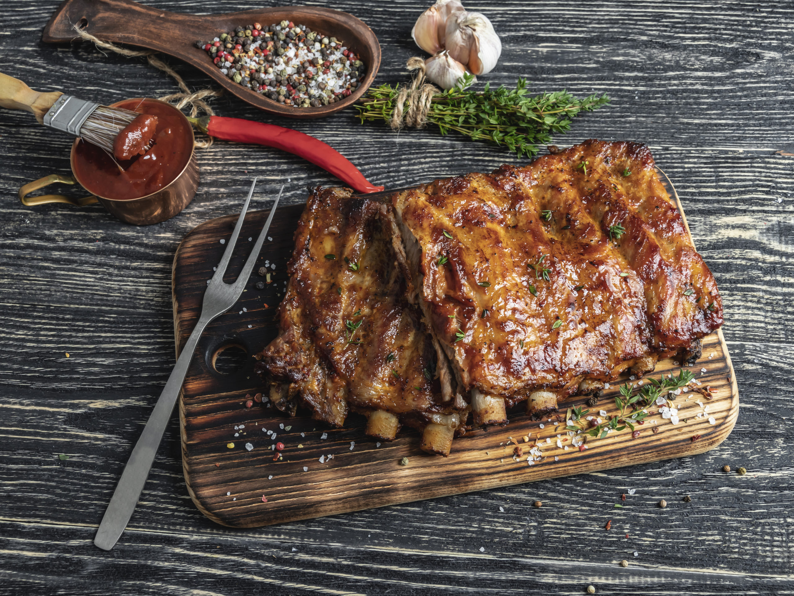 grilled pork ribs with sauce on a cutting board , spice, marinad