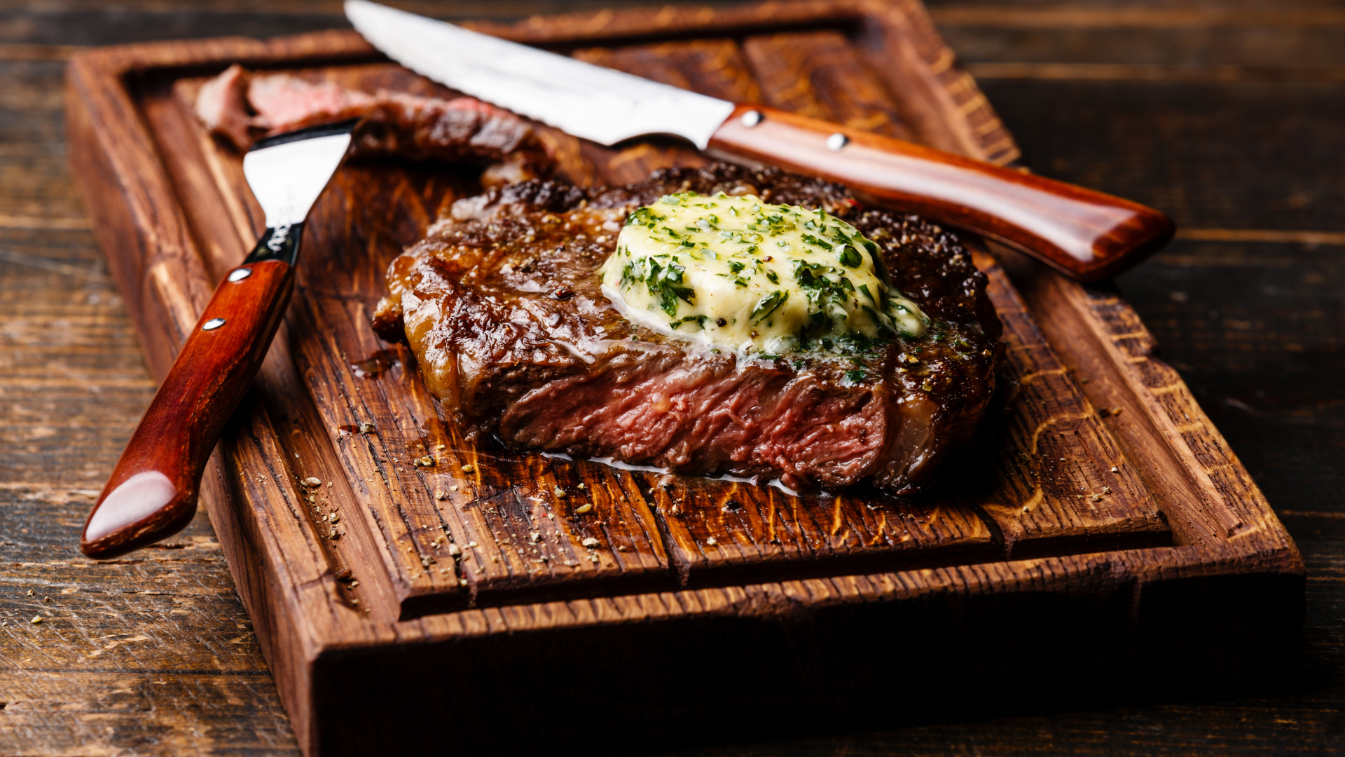 Grilled Bone-In Ribeye with Garlic Herb Butter